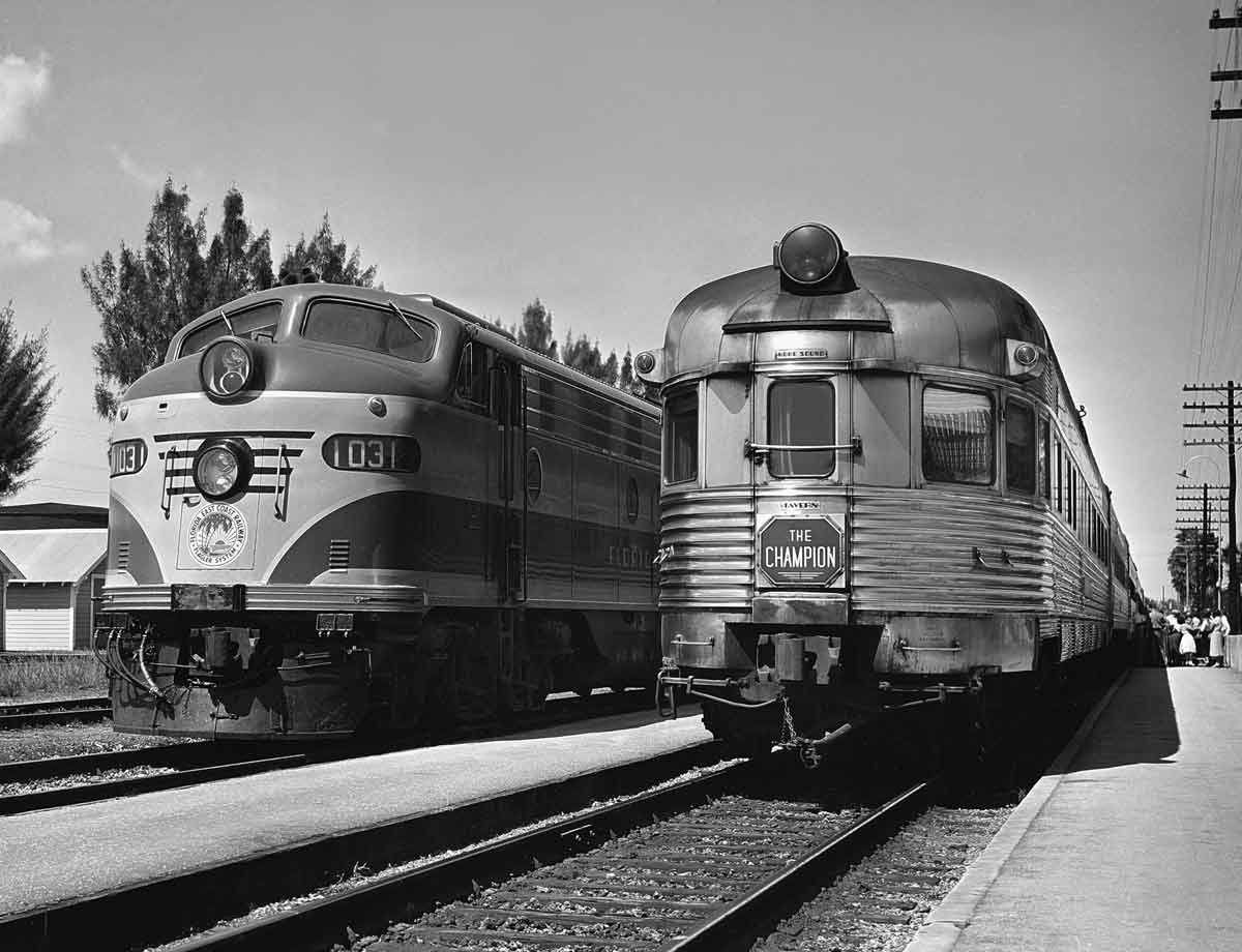 a diesel sitting next to an observation car