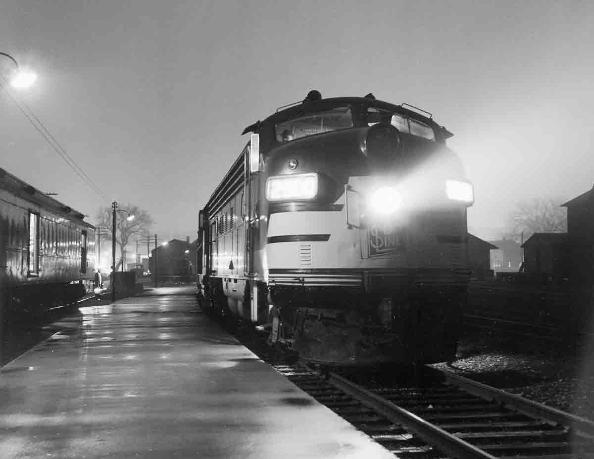 a diesel at a passenger depot at night