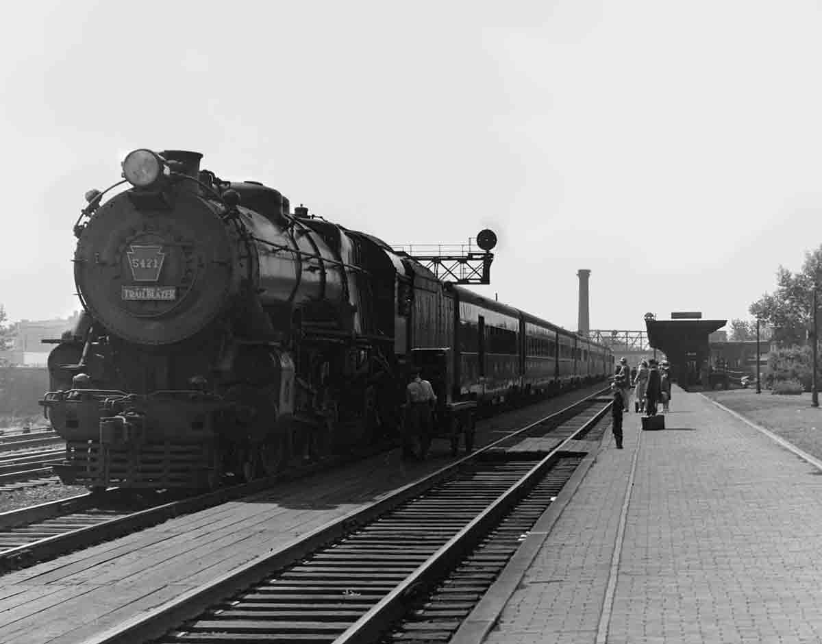 People waiting outside for a train