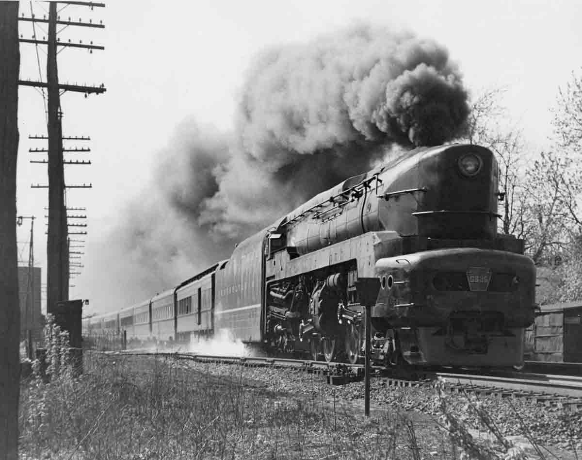 A train passing by with big black smoke