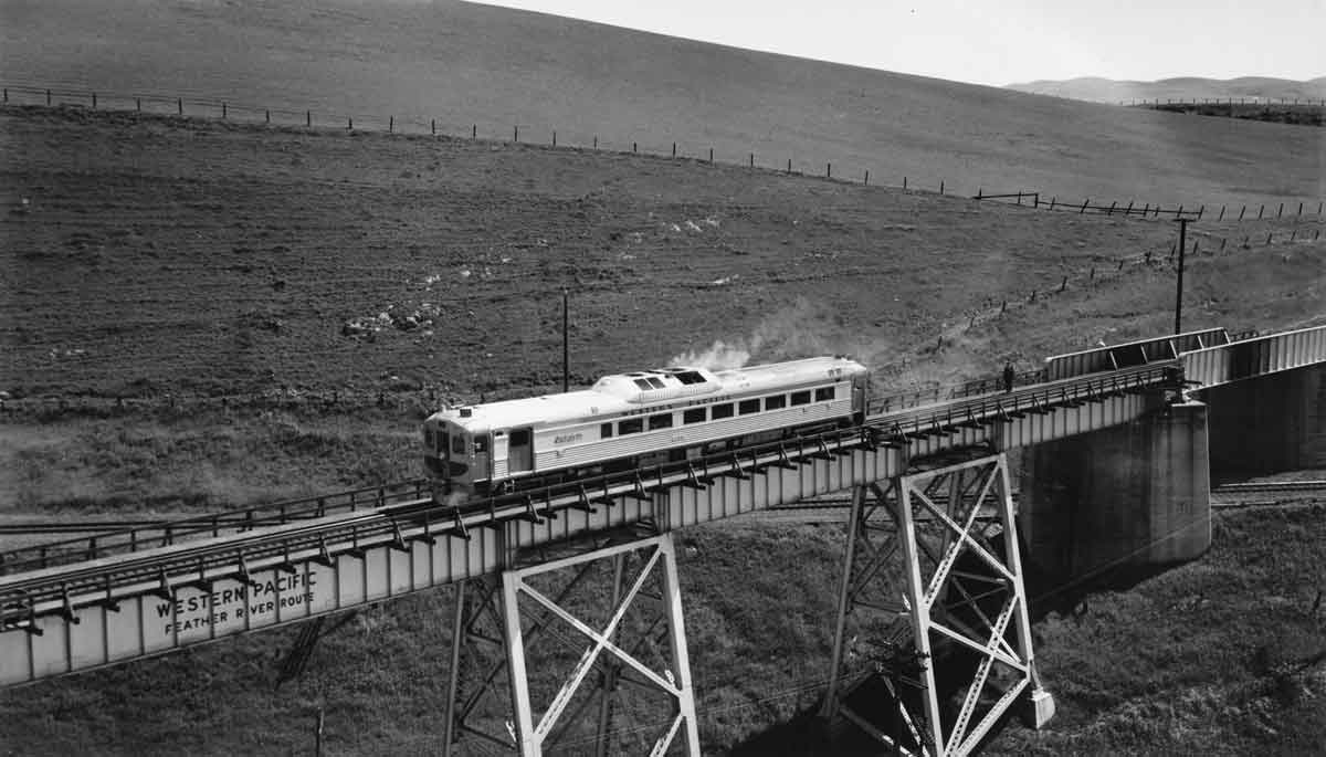 a passenger train going over a bridge