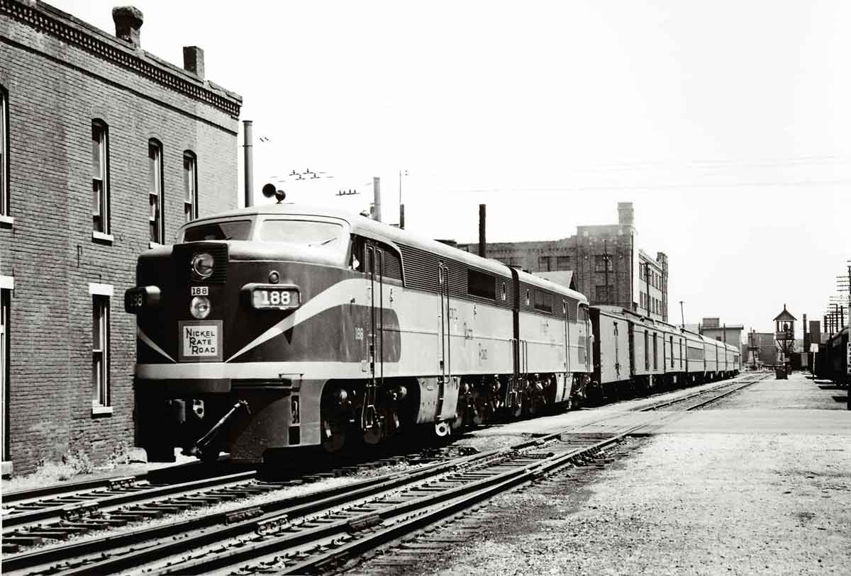 A train parked outside a brick building