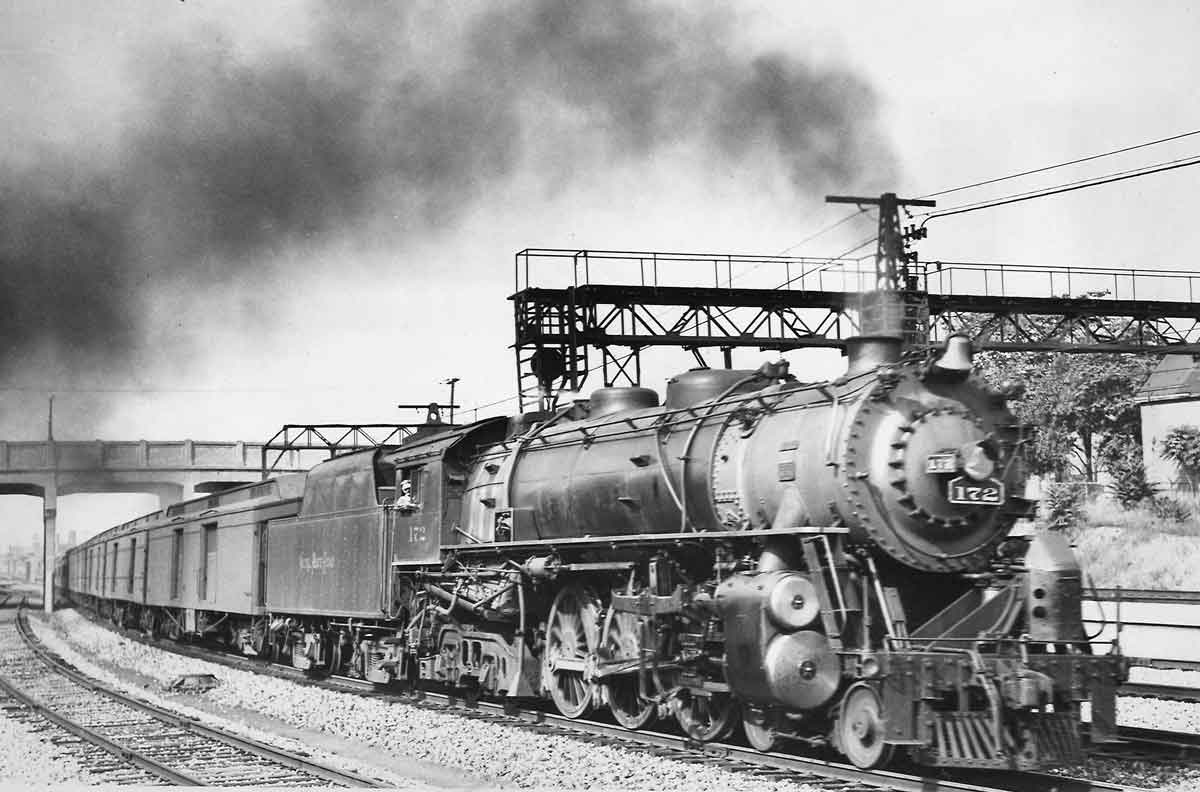 A train passing beneath a bridge