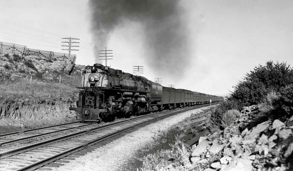 Smoking steam locomotive with passenger train