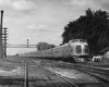 Diesel locomotive approaches diamond crossing on curve