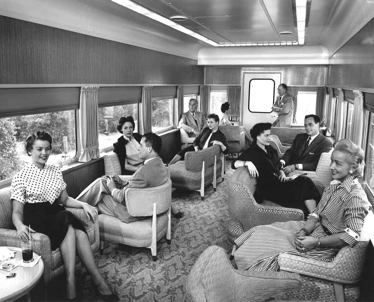 People in passenger train lounge car