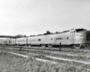Streamlined diesel powered passenger train in yard