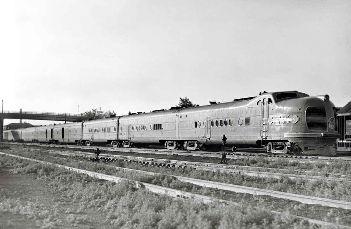 Streamlined diesel powered passenger train in yard