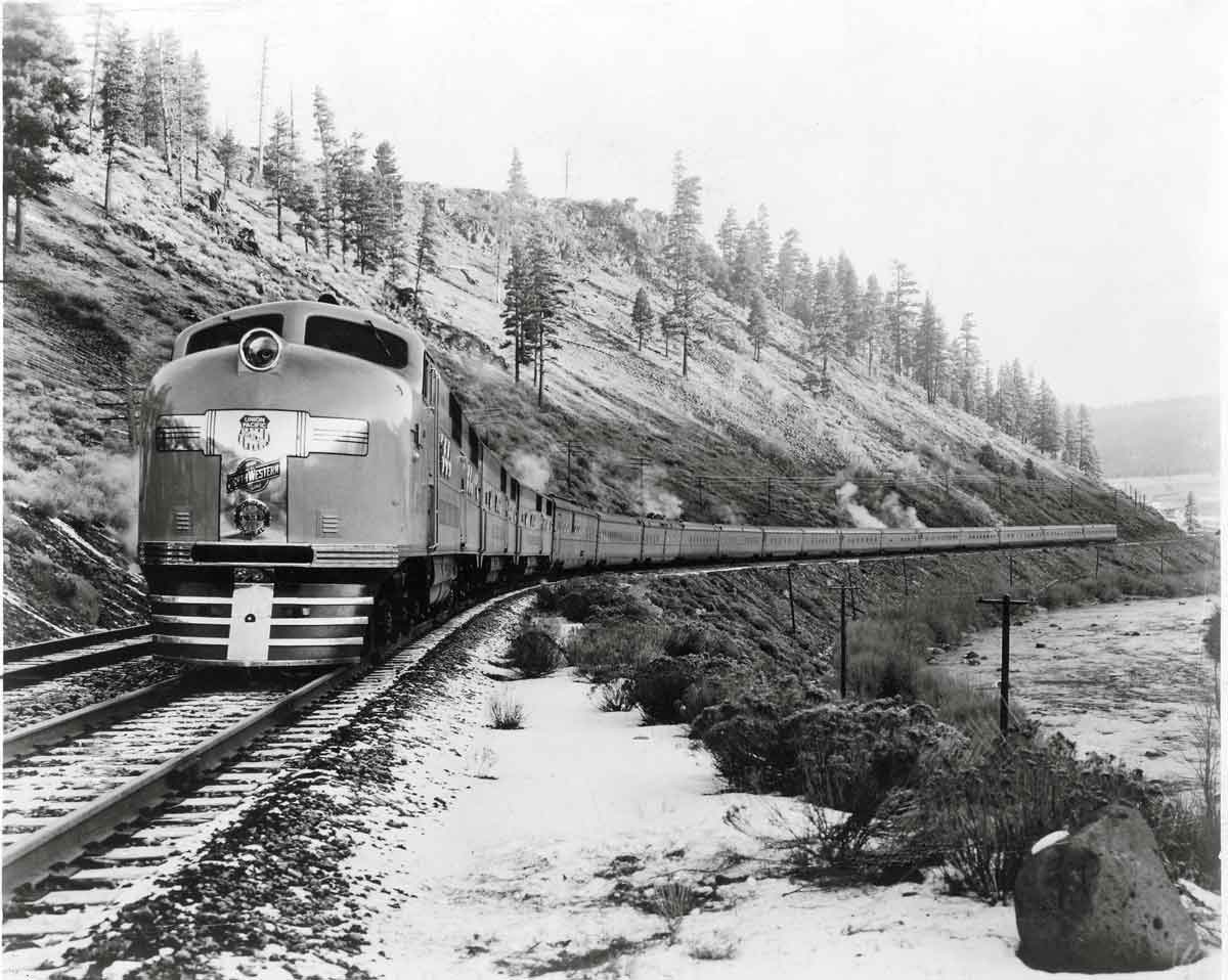 Diesel powered passenger train on curve on hillside