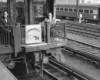 a couple of people sitting on an observer car