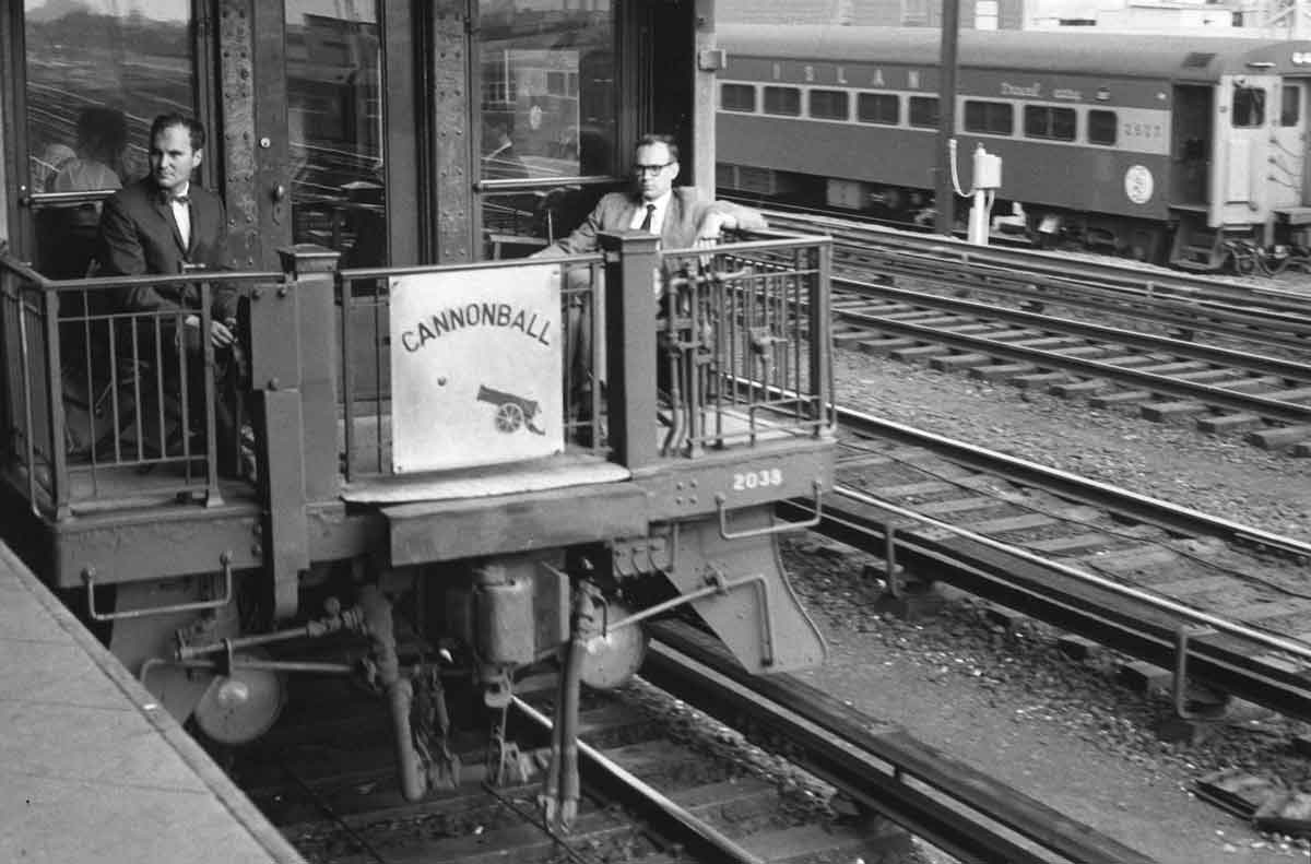 a couple of people sitting on an observer car
