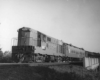a passenger train on an overpass