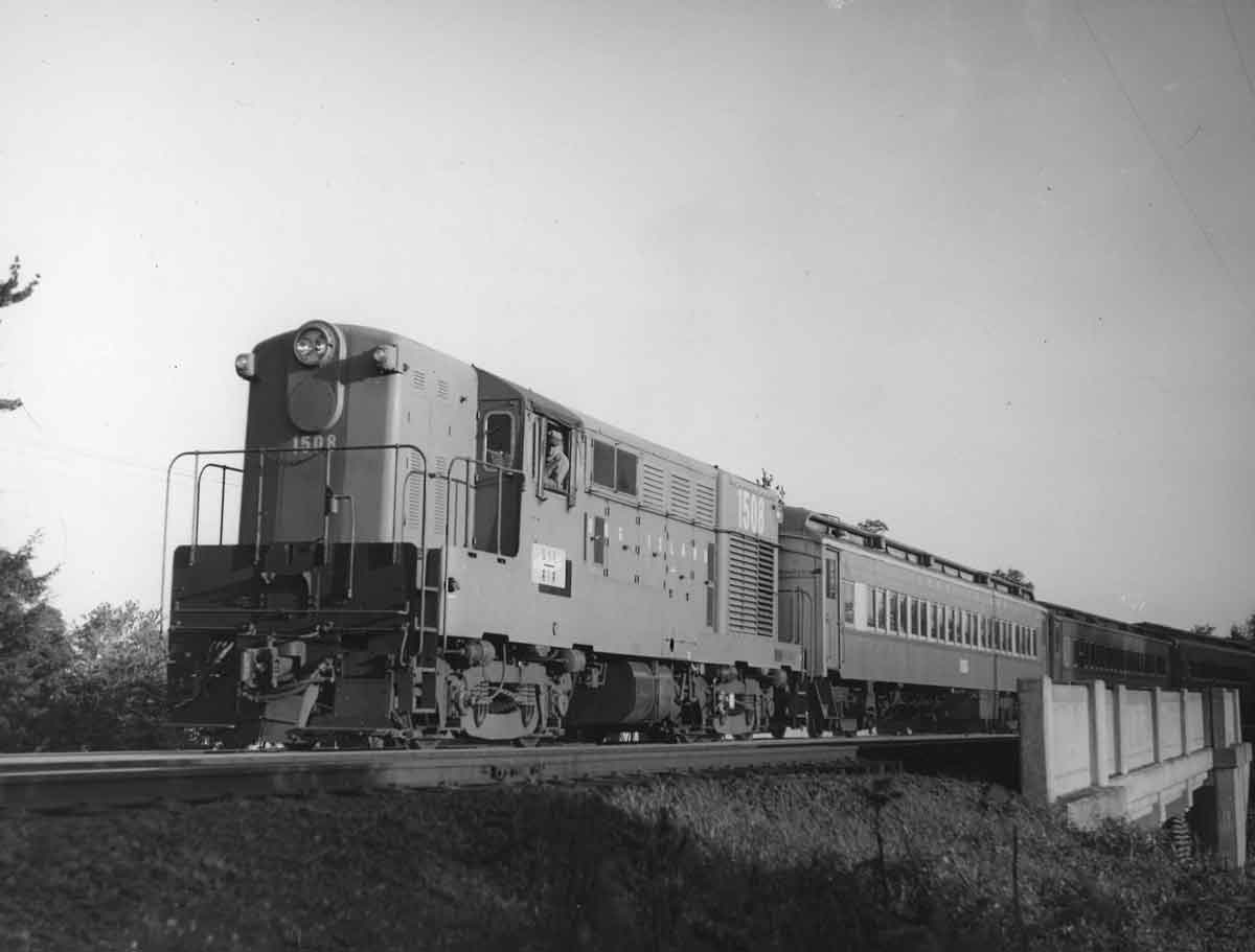 a passenger train on an overpass
