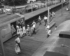 a bunch of passengers getting onto a passenger car