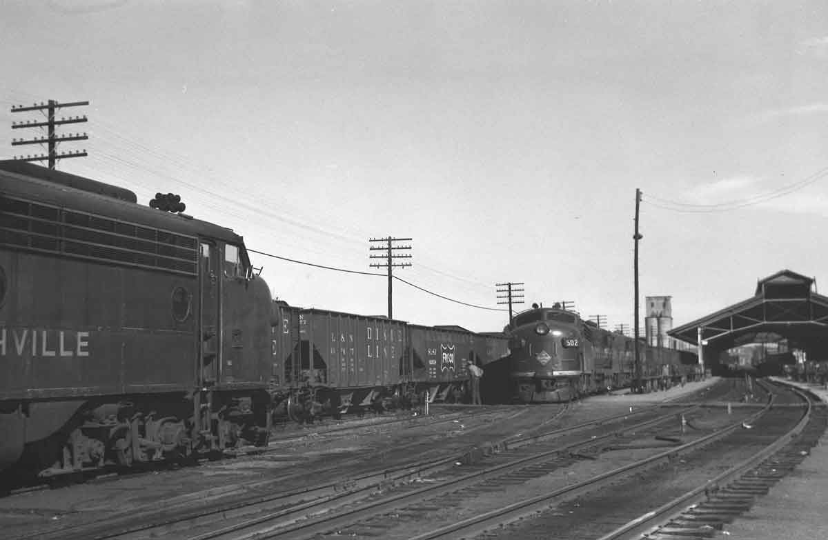three trains at a train station