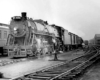 Steam locomotive with passenger train at station