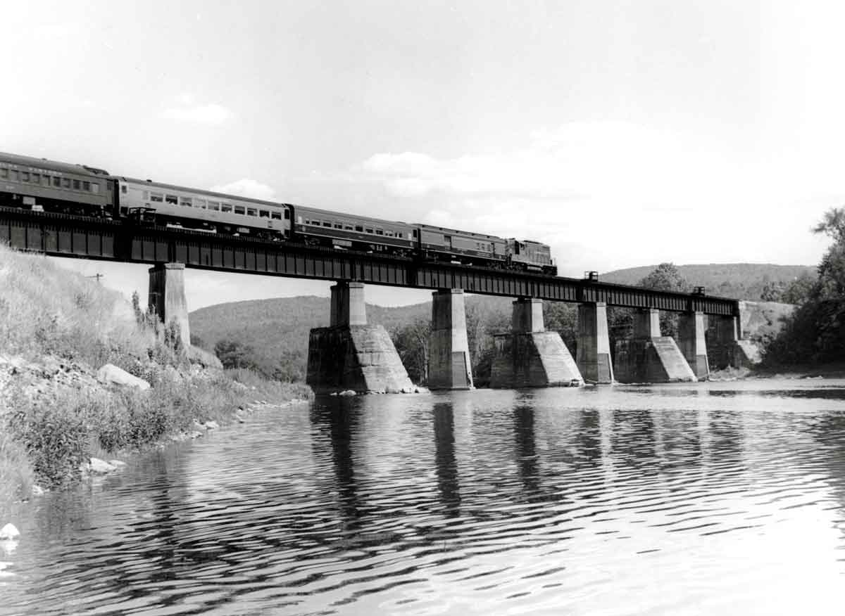 Diesel powered passenger train on bridge