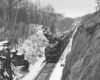 Diesel powered passenger train in rock cut