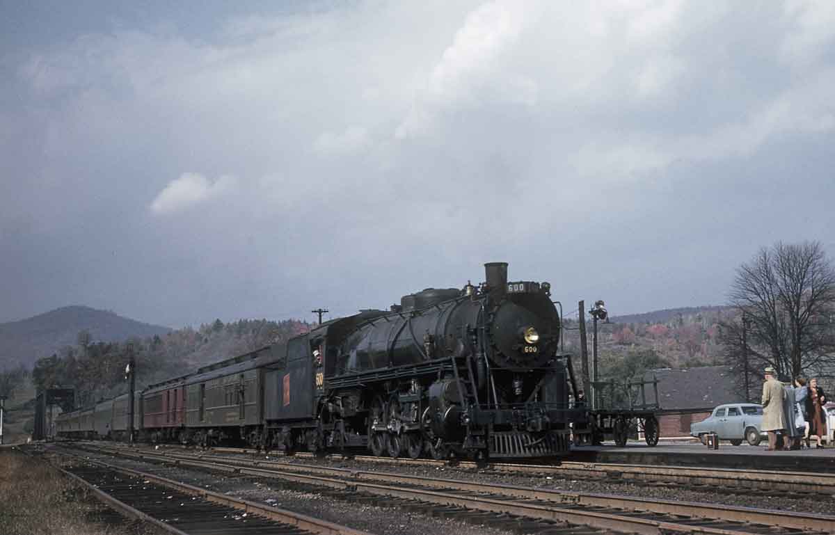 Steam hauled passenger train at station
