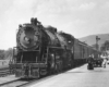 Steam locomotive with passenger train at station