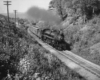 Steam locomotive with passenger train on curve