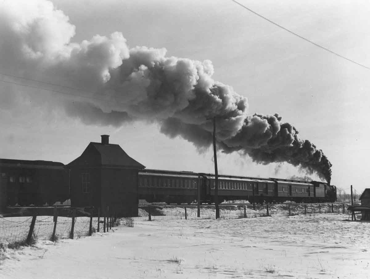 Steam hauled passenger train silhouette