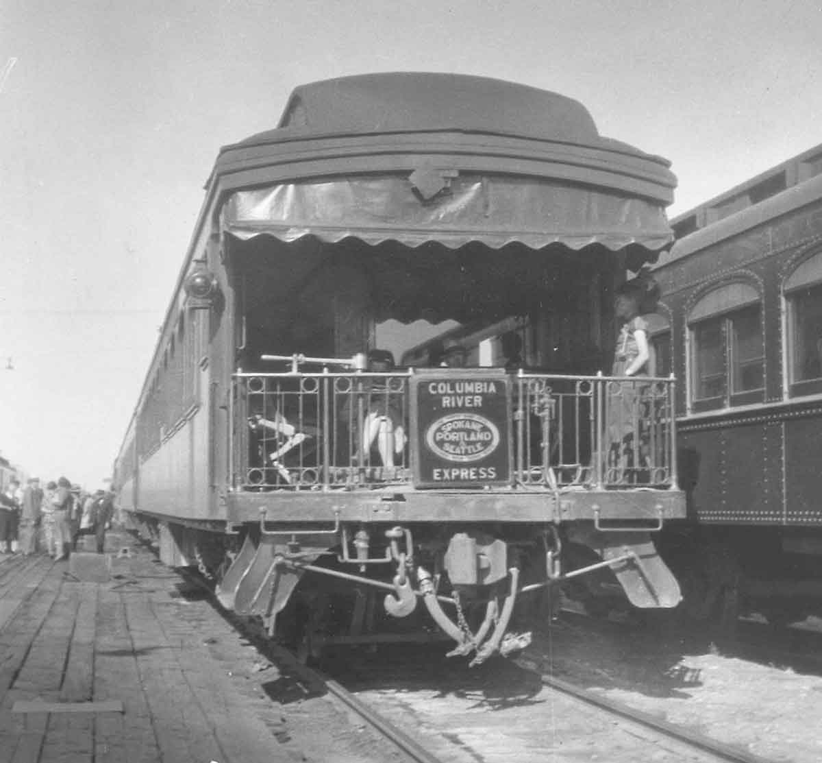A black and white photo of the back of an observatino car