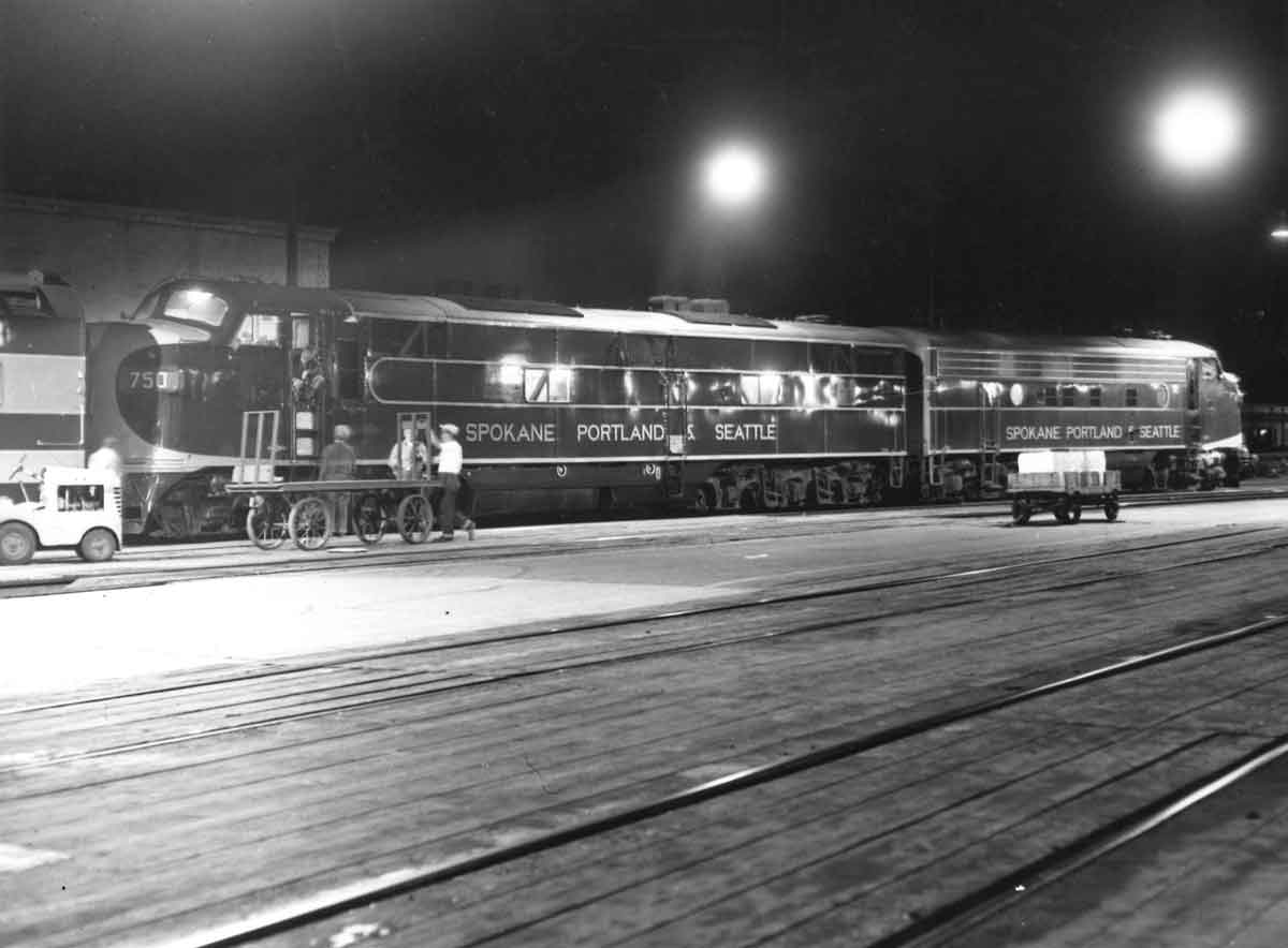 a black and white photo of two diesel locomotives back to back