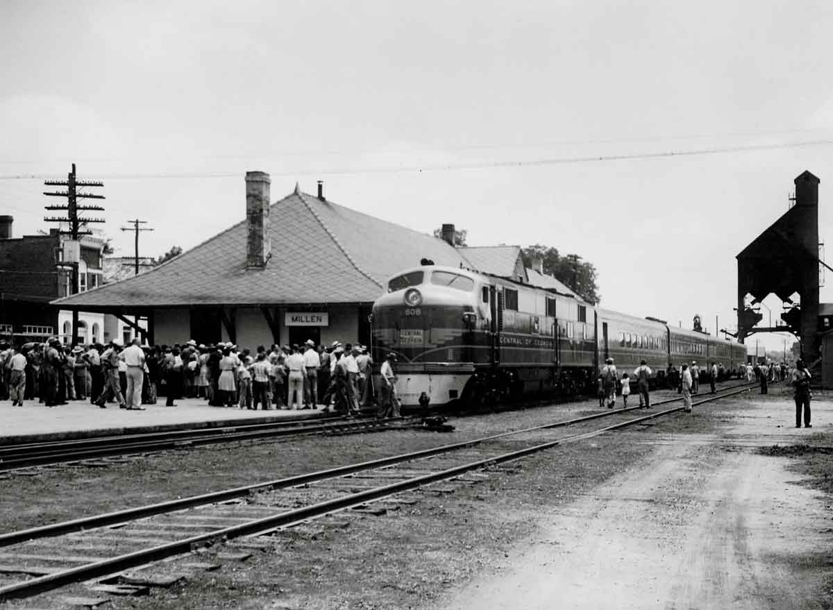 Crowd forms on platform for train's arrival