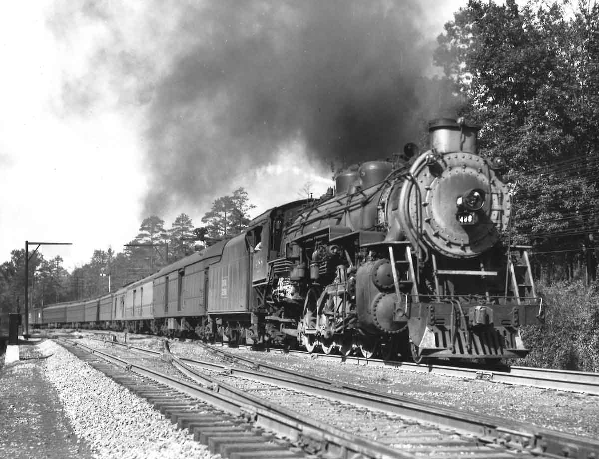 Steam locomotive with passenger train