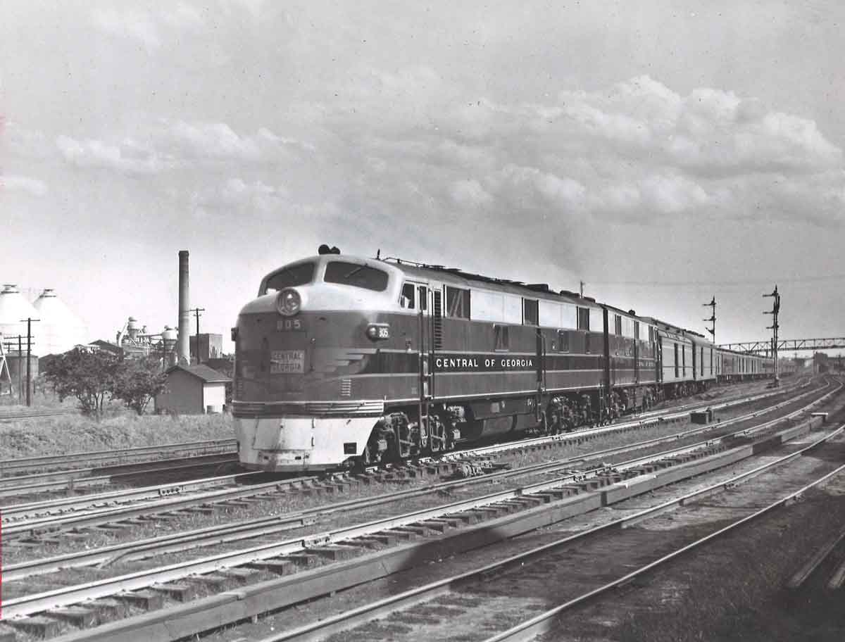 Diesel powered passenger train by semaphore signals