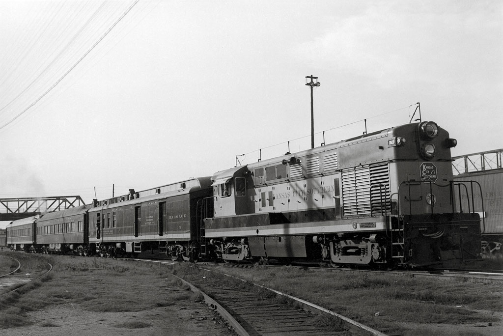A locomotive departing a train station