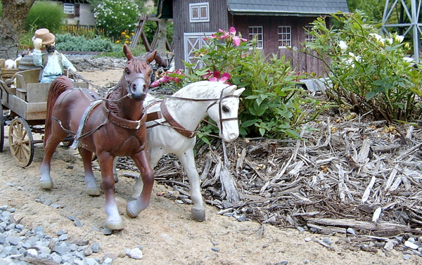 two horses on garden railroad