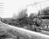 Smoking steam Missouri Pacific locomotives with freight train
