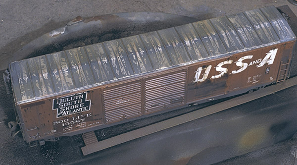 Running board marks. Using a 50-foot running board as a mask, Bob made a mark on the car’s roof to suggest an old running board location.