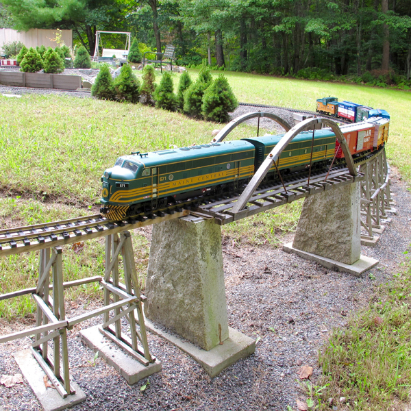 Rails in New England: model train on bridge