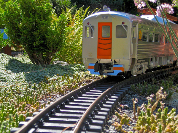 end of model train heading away from the viewer