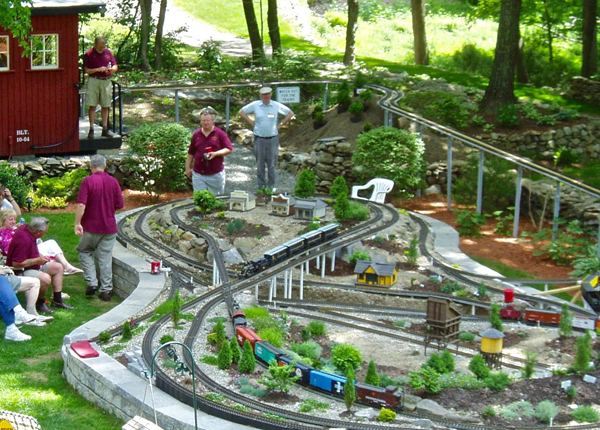 overview of garden railway with people in it