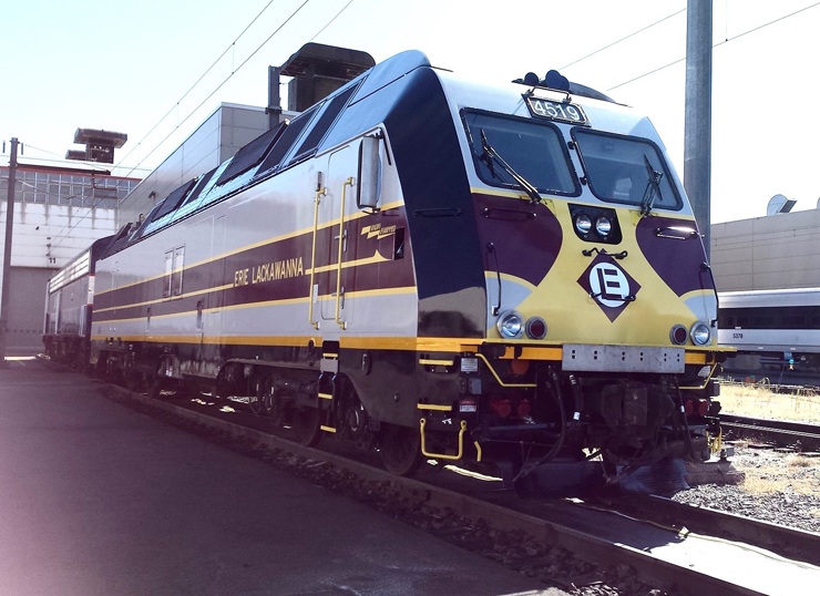 Electric locomotive in maroon, yellow, and silver paint scheme