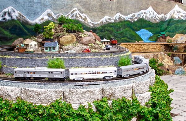 train on curve of garden railroad