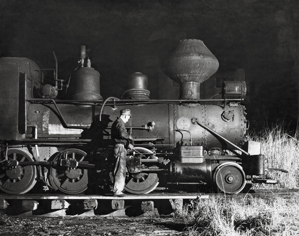 A closeup shot of a guy working on a train