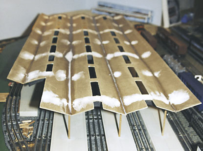 strips of wood with dowel supports