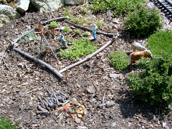 mulch and plants on garden railway