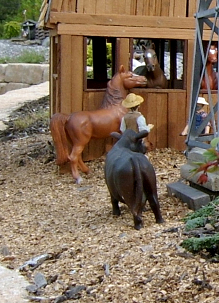 figure and two horses on garden railroad