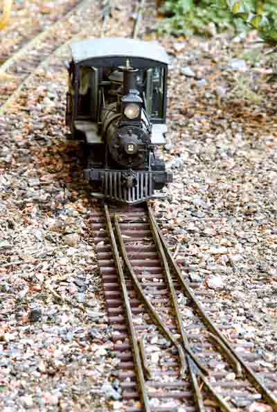 steam locomotive approaches a switch