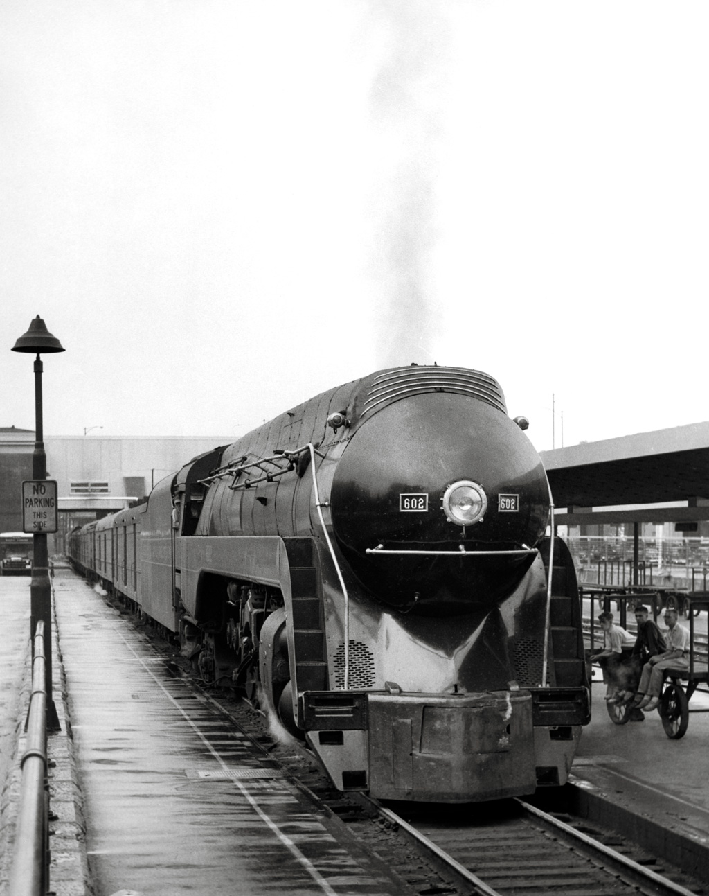A head on shot of a train sitting at a station