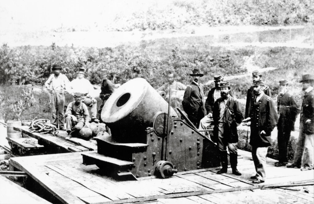 men standing by weapon