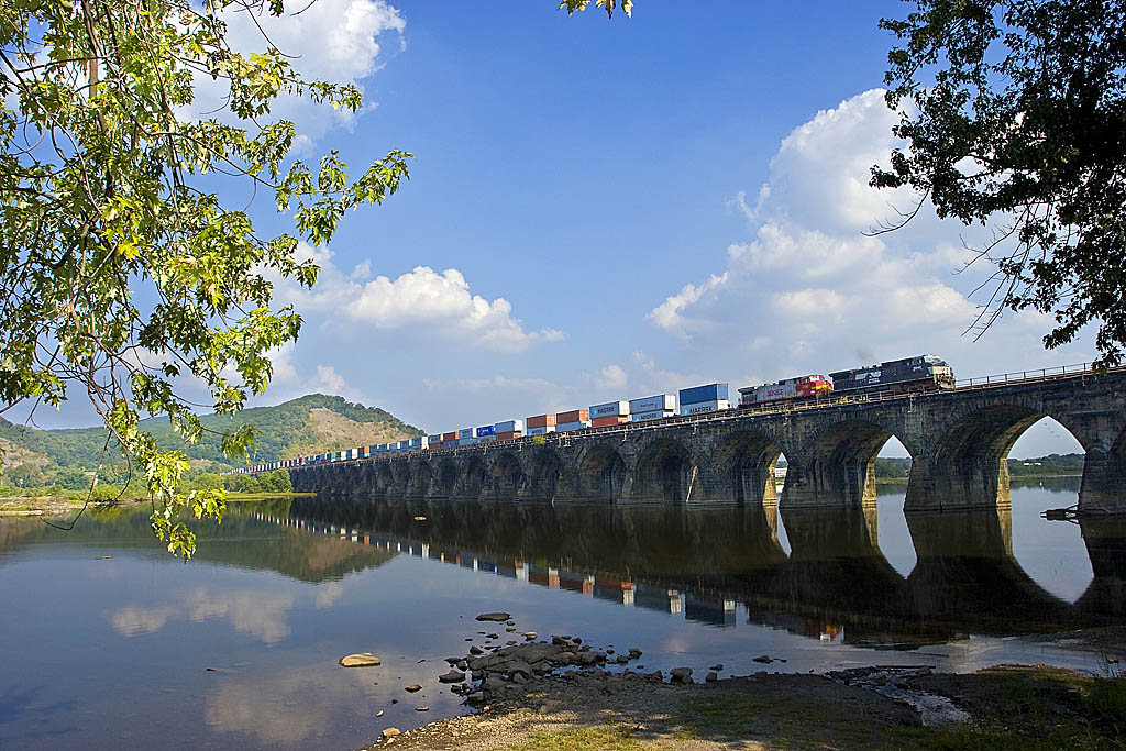 Norfolk Southern stack train traveling over a bridge