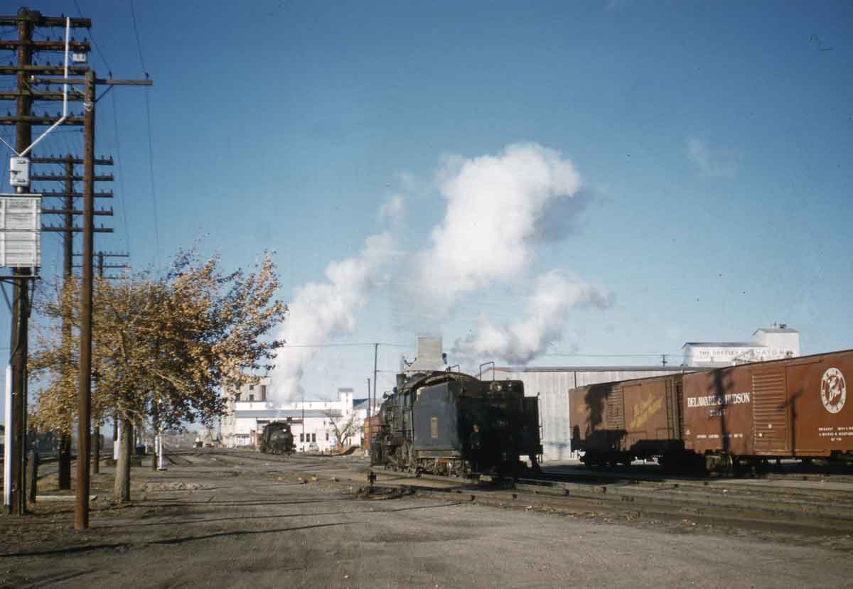 Two train coming head to head at a rail yard