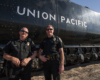Two police officers posing for a picture outside Big Boy
